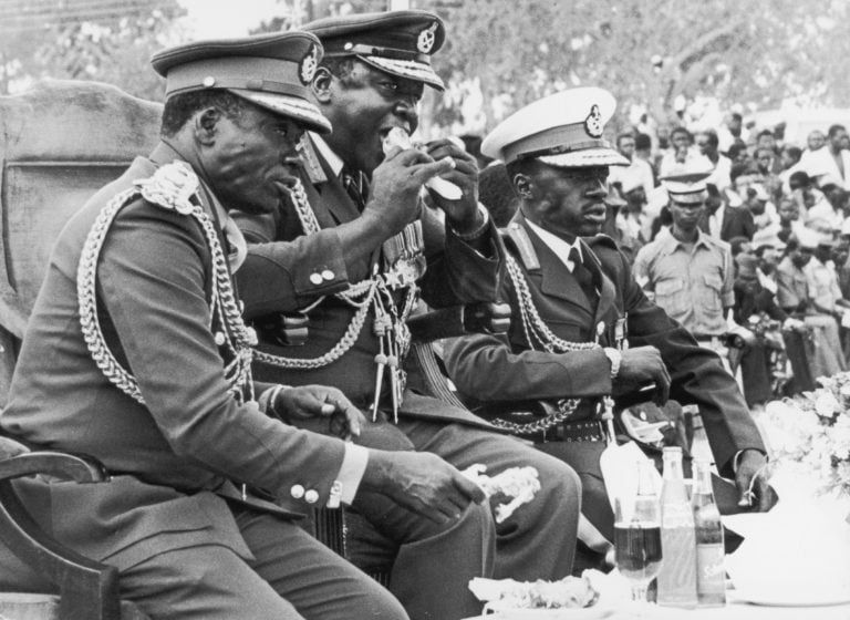Ugandan President Idi Amin eating a roast chicken leg in 1978 (Keystone/Hulton Archive/Getty Images)
