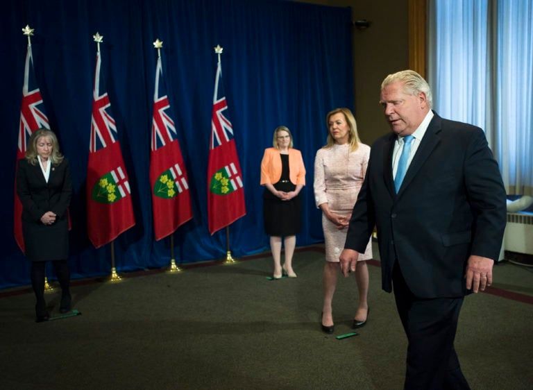 Ford leaves the podium after answering questions about a disturbing report from the Canadian military regarding five Ontario long-term-care homes on May 26, 2020 (Nathan Denette/CP)
