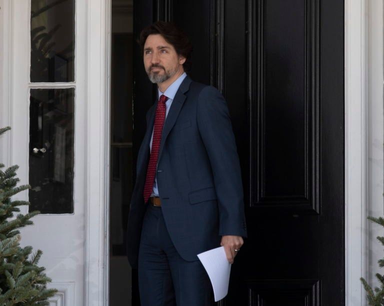 Prime Minister Justin Trudeau closes the front door behind him as he steps out of Rideau Cottage for a daily news conference on the COVID-19 situation in the country, in Ottawa, Thursday, May 14, 2020. THE CANADIAN PRESS/Adrian Wyld