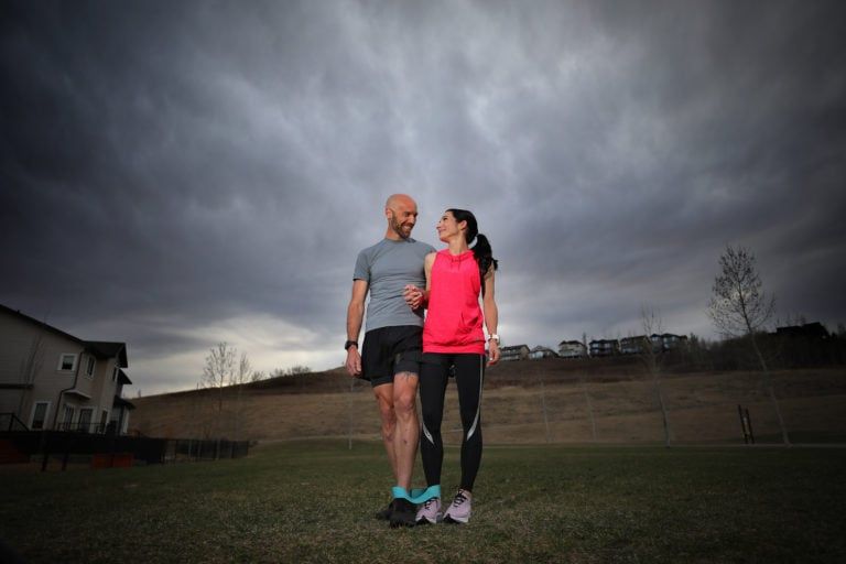 Rainier and Melissa Paauwe, practice for the three-legged competition for Guinness near their home in Calgary, Alta., on April, 30, 2020. (Photograph by Leah Hennel)