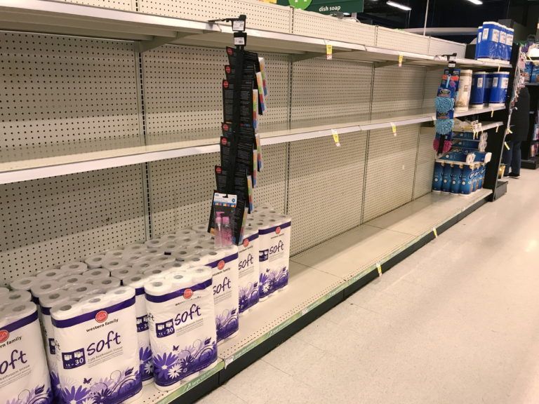 Near-empty toilet paper shelves at a grocery store in North Vancouver, B.C., during the first wave of the pandemic. (Jonathan Hayward/CP)