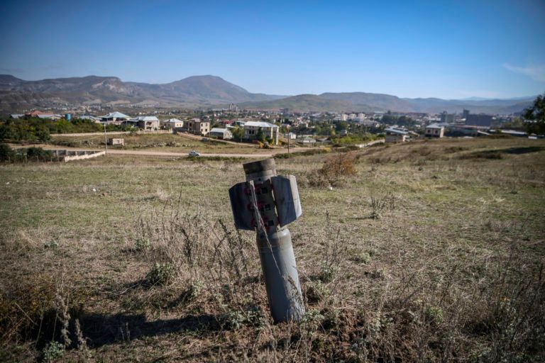 An unexploded BM-30 Smerch missile is seen on the outskirts of Stepanakert on October 12, 2020, during the ongoing military conflict between Armenia and Azerbaijan over the breakaway region of Nagorno-Karabakh. (Aris Messinis/AFP/Getty Images)