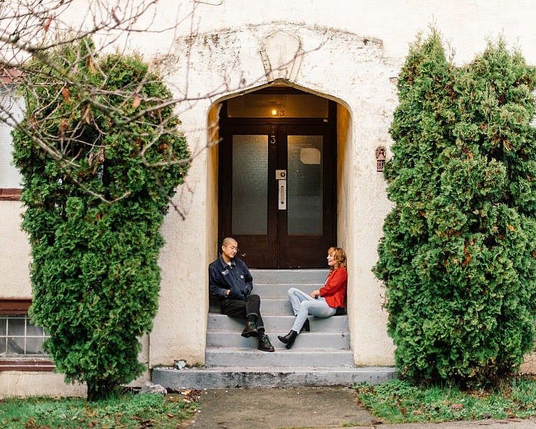Tao (left) and Schofield outside their Vancouver apartment building; the friends are fighting evictions in the city’s Mount Pleasant neighbourhood (Photograph by Alana Paterson)