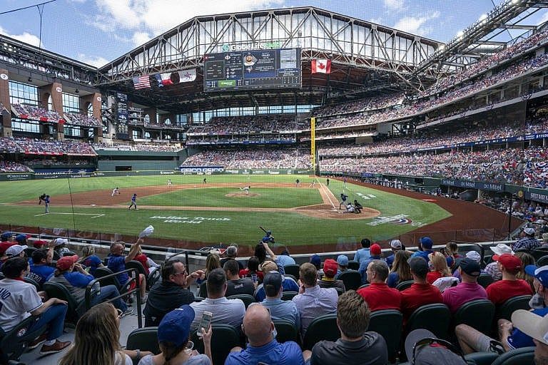 Fans fill the stands at Globe Life Field during the first inning of a baseball game between the Texas Rangers and the Toronto Blue Jays, Monday, April 5, 2021, in Arlington, Texas. The Rangers are set to have the closest thing to a full stadium in pro sports since the coronavirus shutdown more than a year ago. (Jeffrey McWhorter/AP/CP)