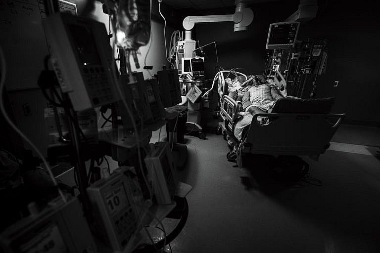The moment of quiet after a patient has been turned onto his back. His nurse has just left the room, after applying balm to his lips and dimming the lights. (Heather Patterson)