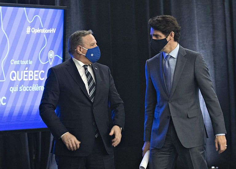 Legault and Trudeau chat after announcing high speed internet for Quebec regions on March 22, 2021, in Trois-Rivieres, Que. (Jacques Boissinot/CP)