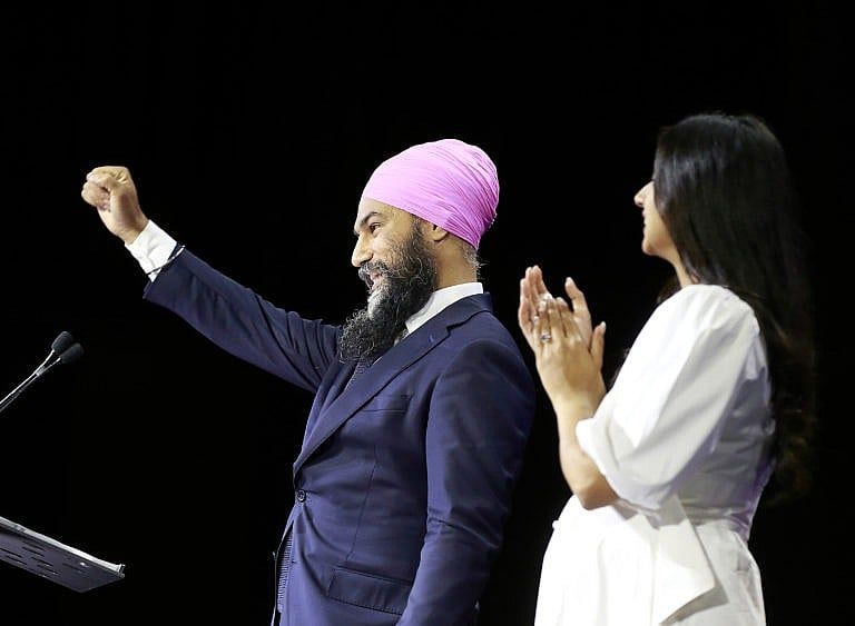 New Democratic Party Leader Jagmeet Singh stands with his wife, Gurkiran Kaur Sidhu, as he delivers remarks at an election night event on September 20, 2021 in Vancouver, Canada. (Jeff Vinnick/Getty Images)