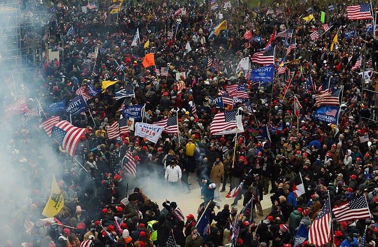 Trump supporters clash with police and security forces as they storm the U.S. Capitol on Jan. 6, 2021.(Roberto Schmid/AFP/Getty Images)