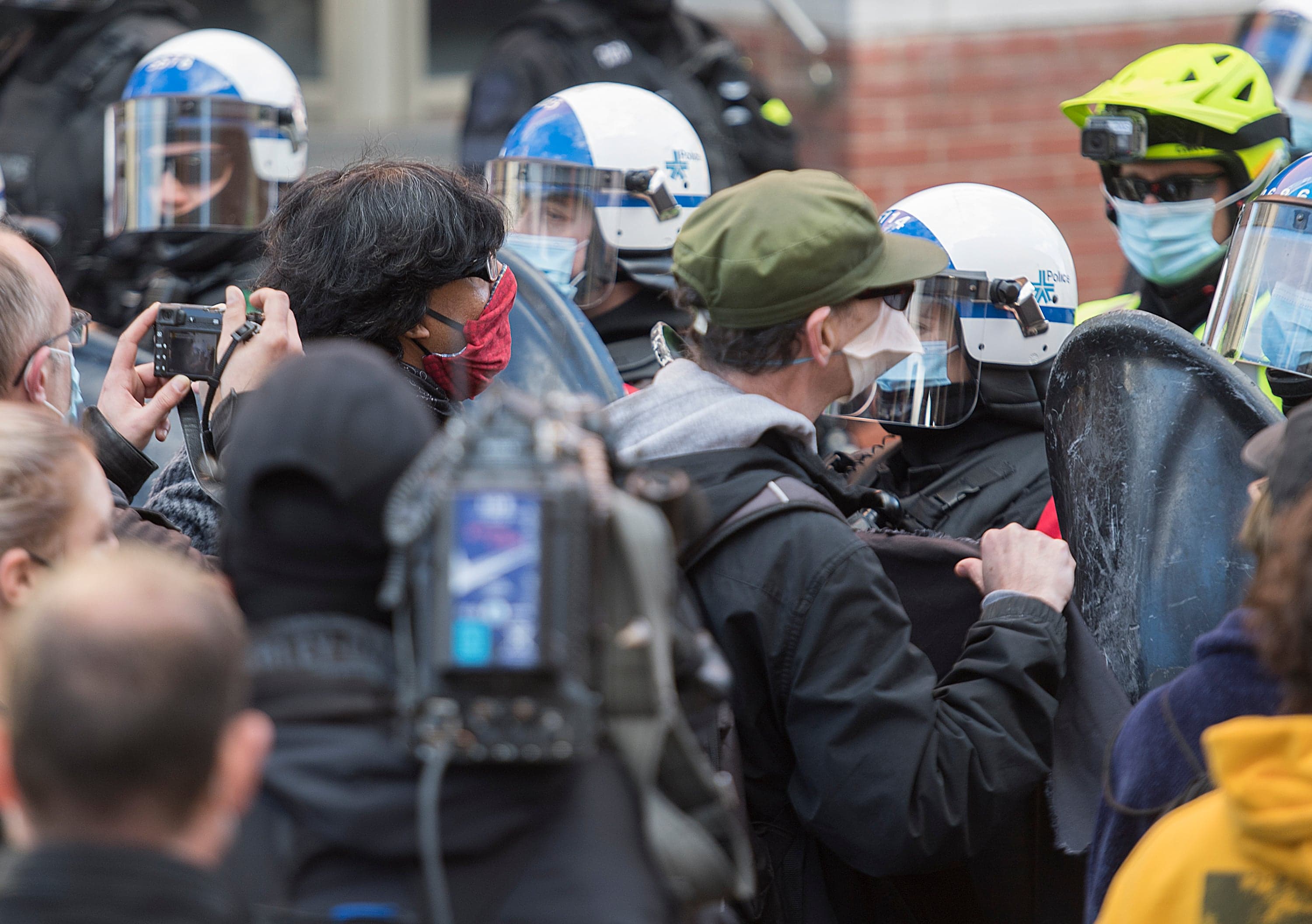 Protesters confront police during a defund-the-police demonstration in Montreal in October. (Graham Hughes/CP)
