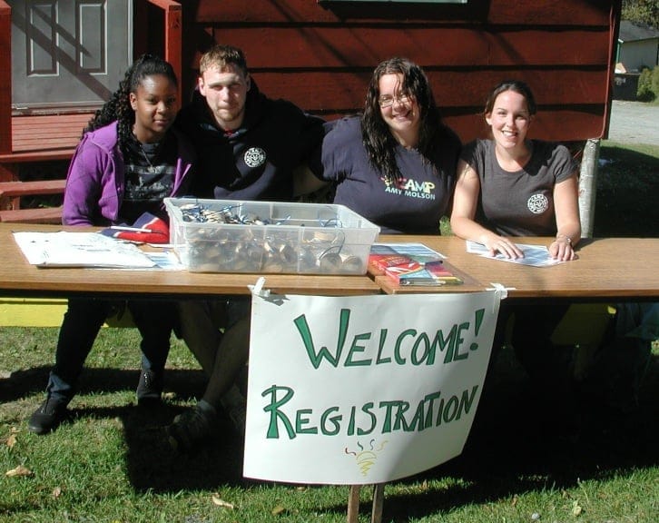 Staff welcome guests to Camp Amy Molson, celebrating it's 65th anniversary