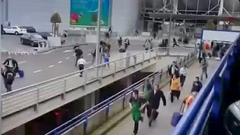 People flee from the Brussels airport in this image taken from video, shot by a bystander in the the immediate aftermath of blasts at the airport near Brussels, Belgium, March 22, 2016. (Reuters)