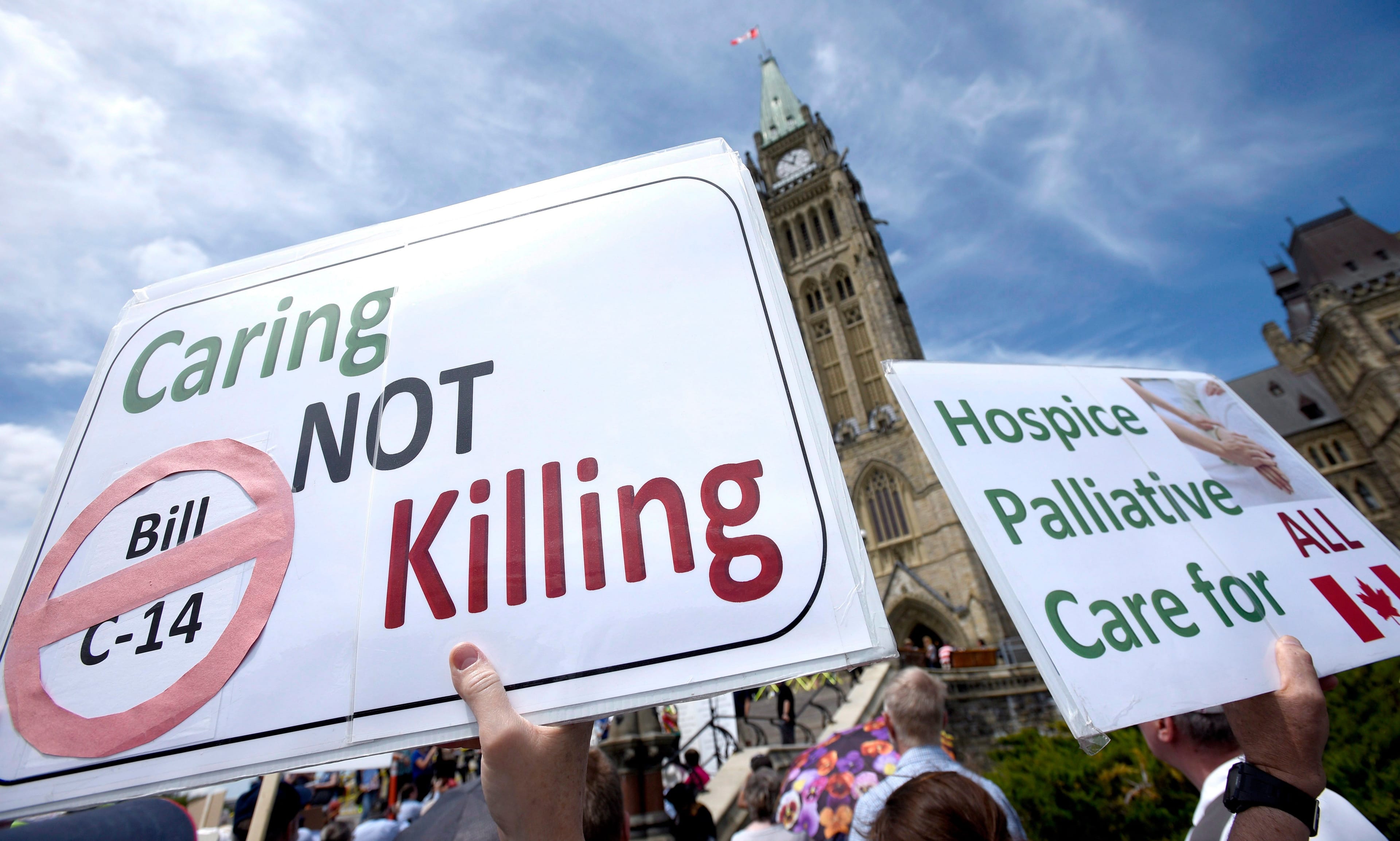 People rally against Bill C-14, the medically assisted dying bill, during a protest organized by the Euthanasia Prevention Coalition on Parliament Hill on Wednesday, June 1, 2016 in Ottawa. THE CANADIAN PRESS/Justin Tang