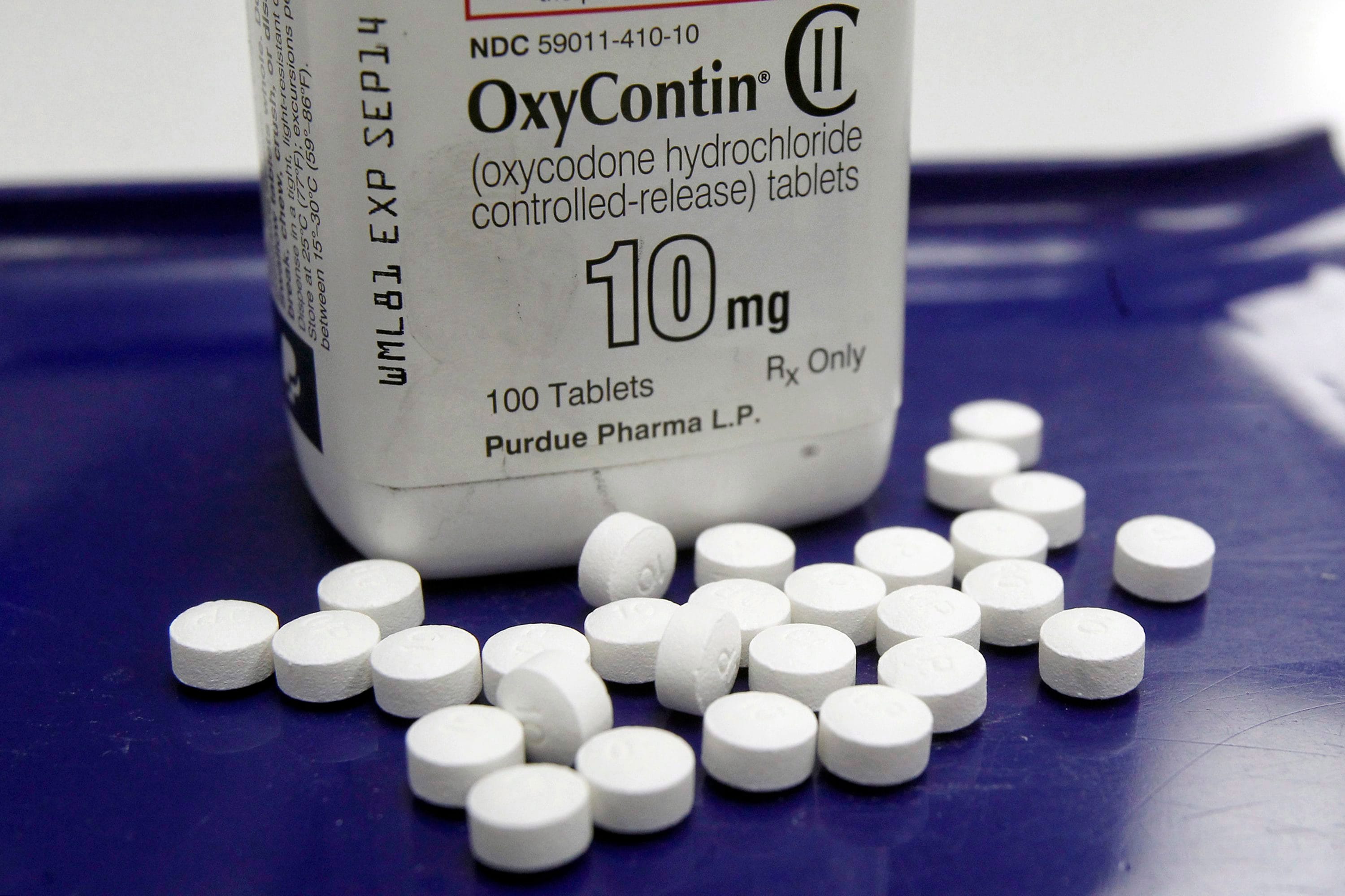 This Feb. 19, 2013 file photo shows OxyContin pills arranged for a photo at a pharmacy in Montpelier, Vt. The state of Montana is seeking a preliminary injunction to prevent the maker of the powerful painkiller OxyContin from marketing opioids to Montana prescribers, seeking to put the force of a court order behind Purdue Pharma's recent promise to end such marketing nationwide. (Toby Talbot/AP)