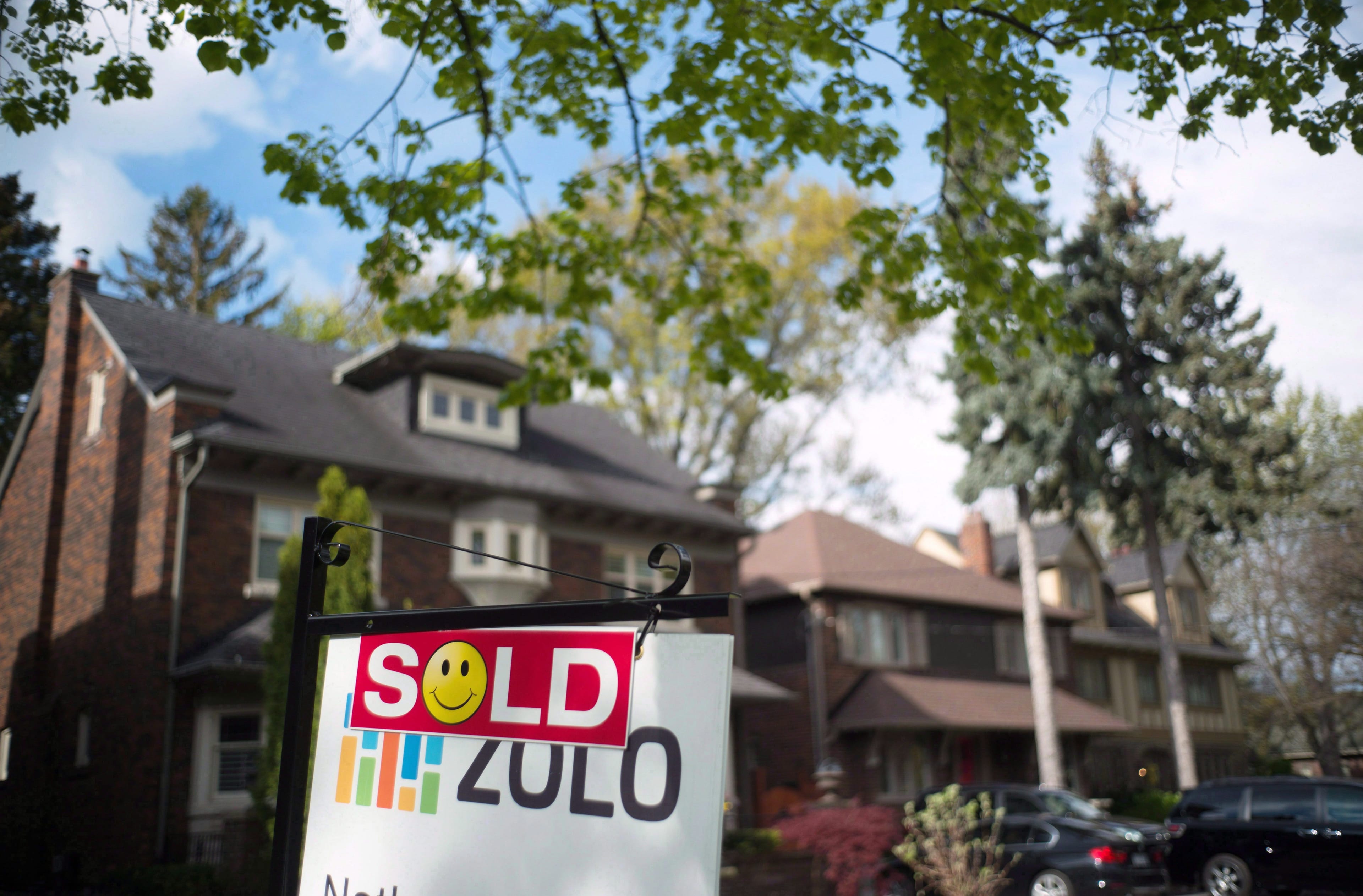 A sold sign is shown in front of west-end Toronto homes Sunday, May 14, 2017. The end might be near for a seven-year battle that has kept the public from easily finding out online what homes in the Greater Toronto Area sold for.THE CANADIAN PRESS/Graeme Roy
