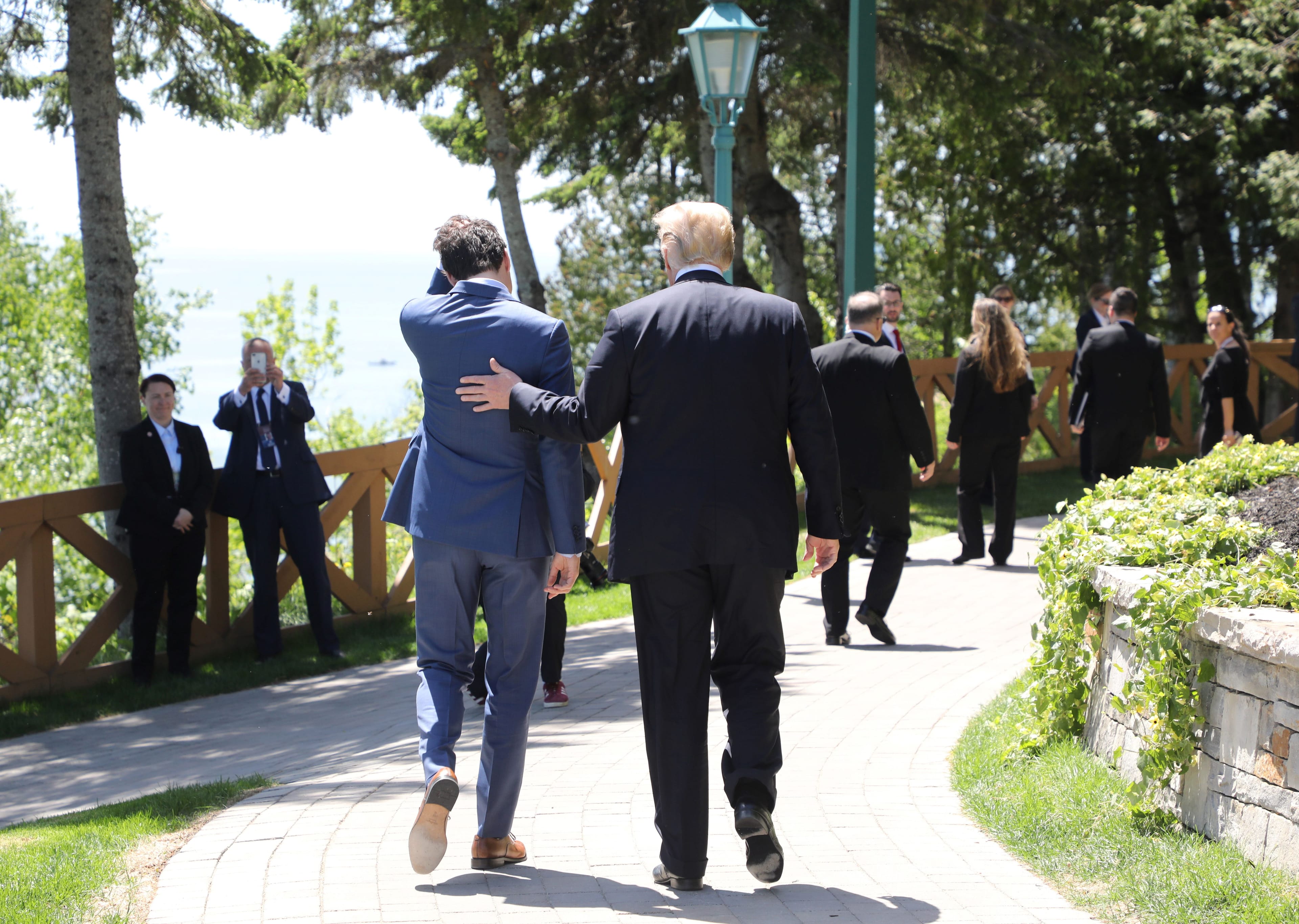 Canadian Prime Minister Justin Trudeau (L) walks with US President Donald Trump during the official G7 Summit welcoming ceremony, June 8, 2018 in La Malbaie, Canada. (Photo by Ludovic MARIN / AFP) / POOL FOR EPA, SIPA, BESTIMAGE (Photo credit should read LUDOVIC MARIN/AFP/Getty Images)