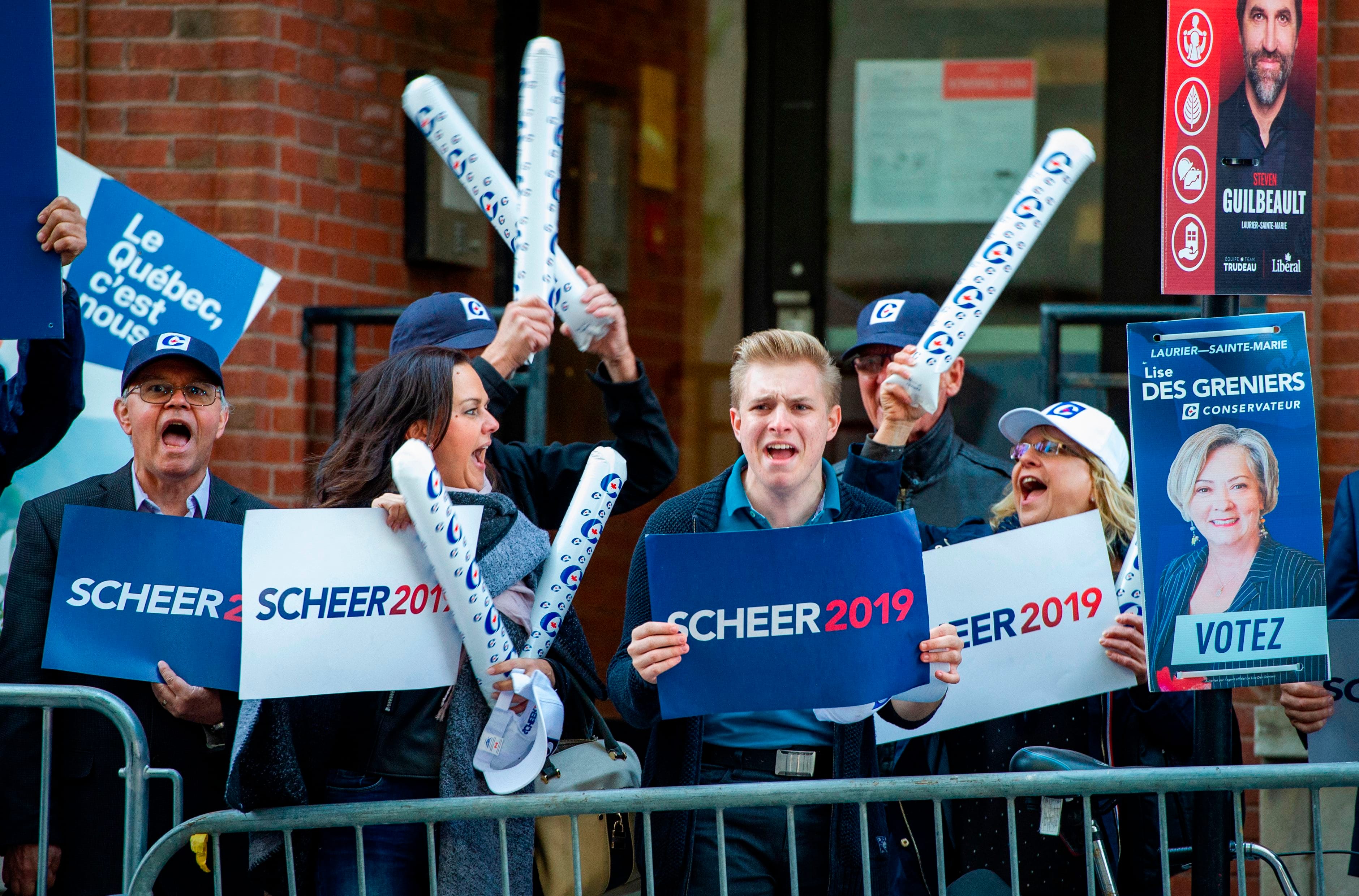 Supporters await the arrival of party leaders for the French debate for the 2019 federal election, the "Face-a-Face 2019" presented in the TVA studios, in Montreal, Quebec, Canada, on Oct. 2. (Photo by Sebastien St-Jean/AFP via Getty Images)