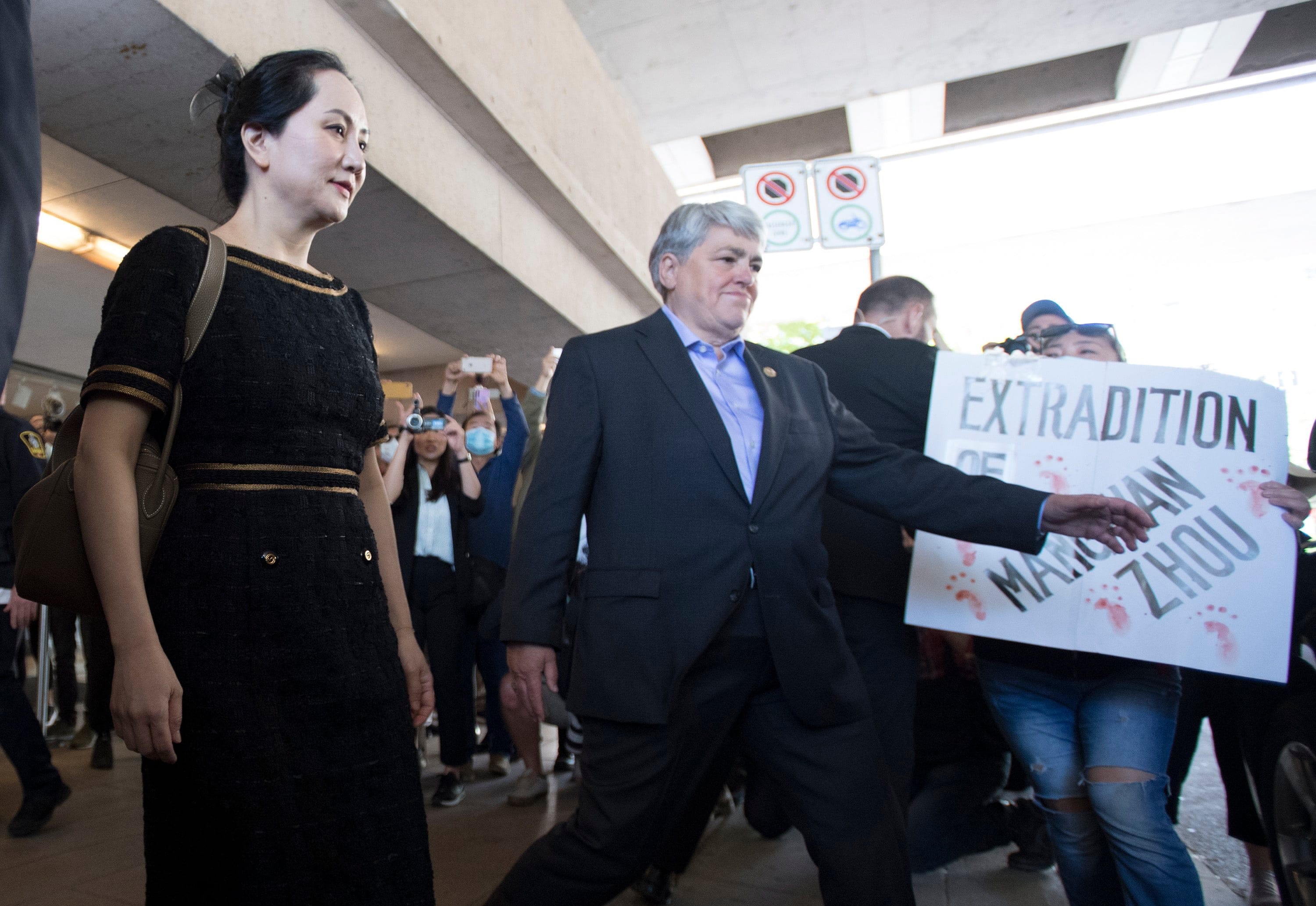 Meng leaves B.C Supreme Court after a justice dismissed her application to be discharged from extradition proceedings. (Jonathan Hayward/CP)