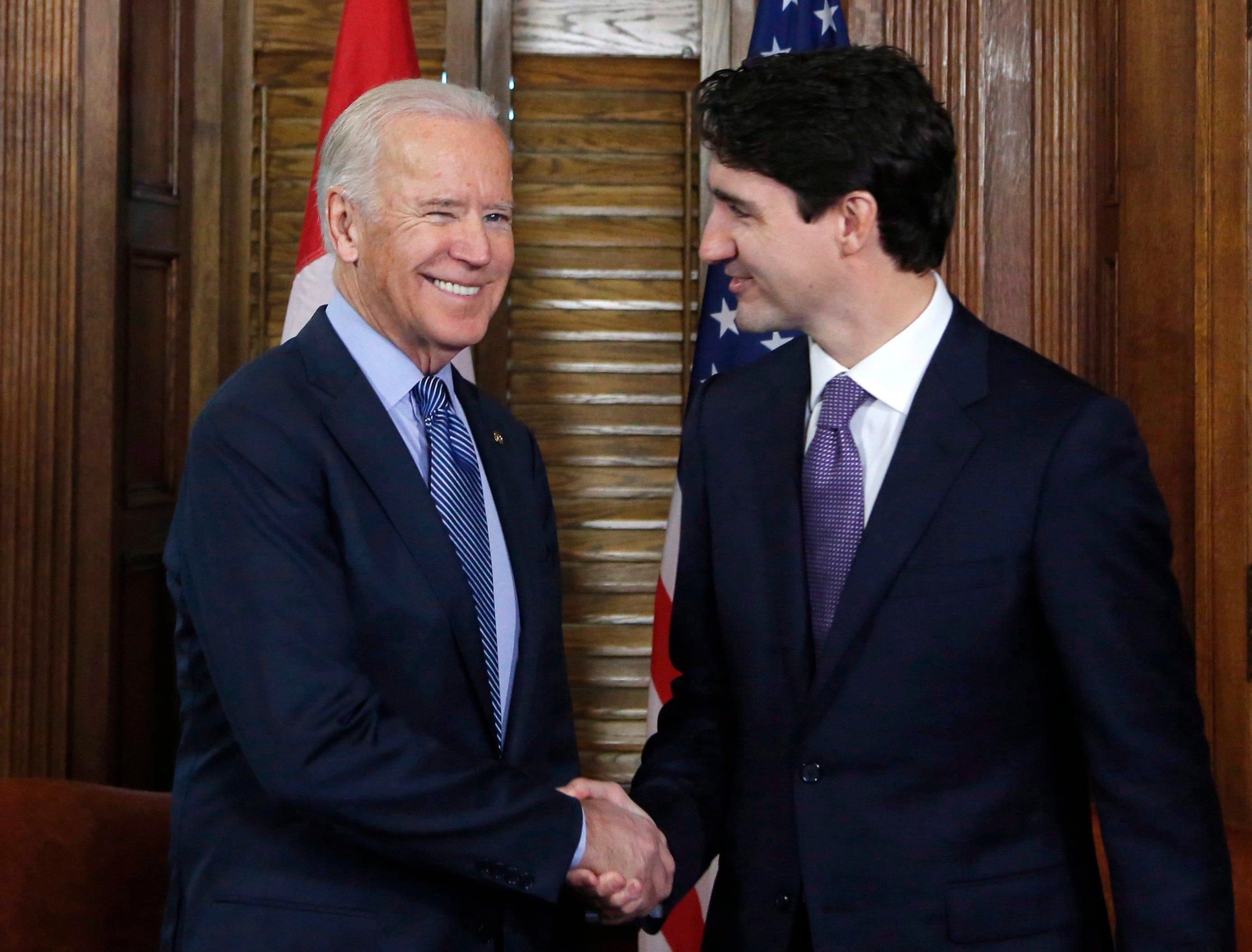 Prime Minister Justin Trudeau shakes hands with then-vice president Joe Biden on Parliament Hill in Ottawa on Friday, December 9, 2016. (Patrick Doyle/CP)
