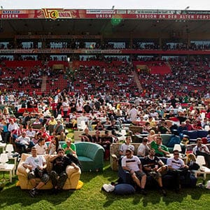 People watch Germany playing against Portugal in a World Cup soccer match during a public viewing event at the Alte Foersterei stadium in Berlin