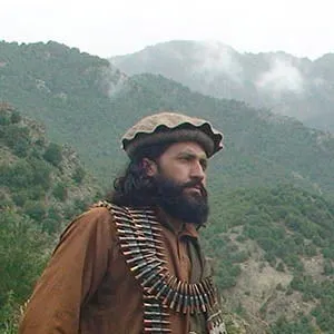 FILE - In this Aug. 5, 2012 file photo, Pakistani Taliban patrol in their stronghold of Shawal in the Pakistani tribal region of South Waziristan. Pakistan has stepped up outreach to some of its biggest enemies in Afghanistan, a significant policy shift that could prove crucial to U.S.-backed efforts to strike a peace deal in the war-torn country.The target of the diplomatic push has mainly been non-Pashtun political leaders who have been at odds with Pakistan for years because of the country's historical support for the Afghan Taliban, a Pashtun movement. (Ishtiaq Mahsud/AP)