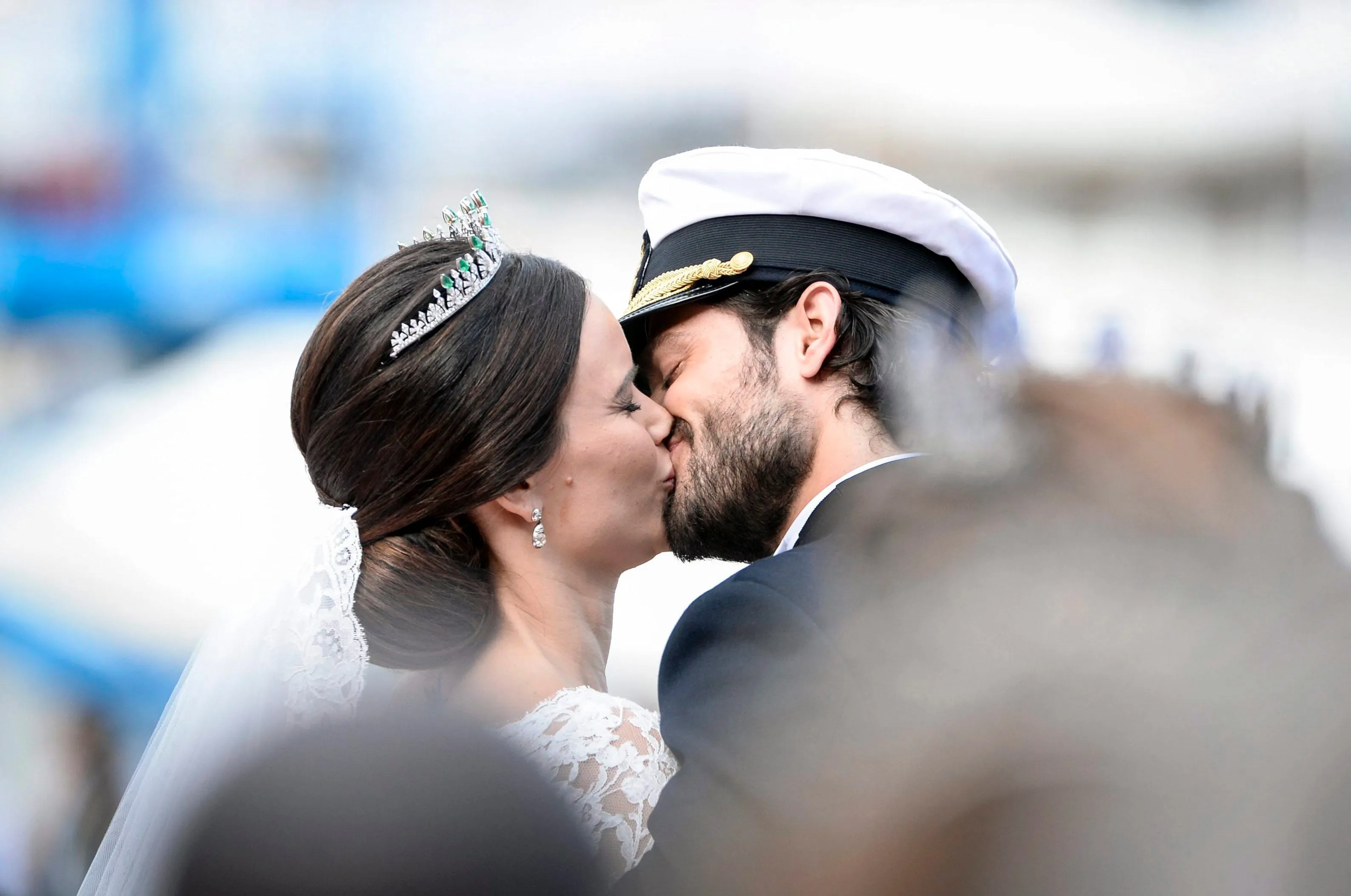 Sweden's Prince Carl Philip kisses his bride, Sofia Hellqvist in a carriage, after their wedding ceremony, in Stockholm, Sweden, Saturday, June 13, 2015. The only son of King Carl XVI Gustaf and Queen Silvia has married his Swedish fiancee in a lavish ceremony in Stockholm. Prince Carl Philip and the former reality starlet and model Sofia Hellqvist, 30, tied the knot Saturday at the Royal Palace chapel before five European queens, a Japanese princess and dozens of other blue-blooded guests. The couple engaged in June 2014. (Pontus Lundahl / TT via AP)