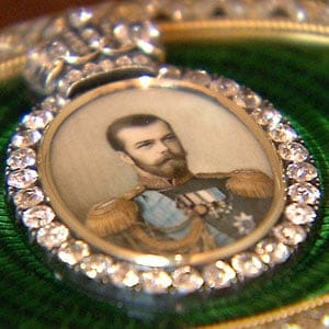 Detail of Imperial presentation box, Faberge, late 1880s. Incroporates miniature portrait of Tsar Nicholas II set with large diamonds and green enamal surround. (Arts Alliance)
