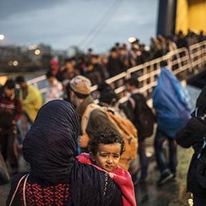 ATHENS, GREECE - SEPTEMBER 24: Refugees are seen at the port after arriving in Athens, Greece on September 24, 2015. Refugees who begin a journey with a hope to have high living standards away from conflicts, continue using Greece's Lesbos Island as a transit point on their way to Europe. After arriving in Lesbos Island, refugees get a ferryboat to go to Athens. (Ozge Elif Kizil/Anadolu Agency/Getty Images)