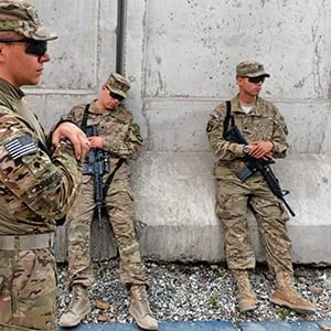 US soldiers of the Combined Team Nangarhar of the CT Bastogne, 1st Brigade Combat Team, 101st Airborne Division (Air Assault) of the United States take a break after an award ceremony at Forward Operating Base, Finley Shields in Jalalabad in Nangarhar province on April 6, 2013. An estimated 100,000 foreign troops have been fighting the Taliban for the past 11 years and are due to leave Afghanistan by December 31, 2014 to be replaced by a smaller contingent to train and advise their local counterparts. (Manjunath Kiran/AFP/Getty Images)
