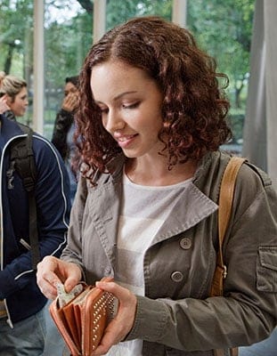 University student paying in college cafe