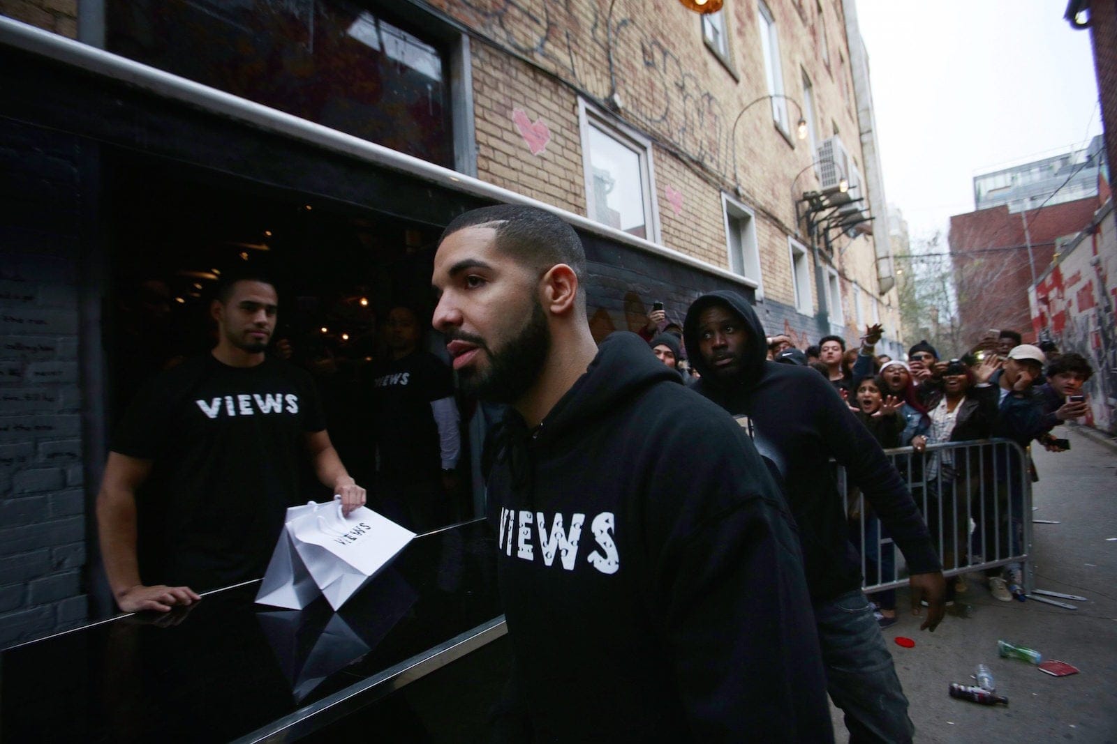 Toronto rapper Drake leaves a Queen St. West pop up shop where he was handing out T-shirts to promote his album 'Views' in Toronto on Sunday, April 24, 2016. THE CANADIAN PRESS/Cole Burston