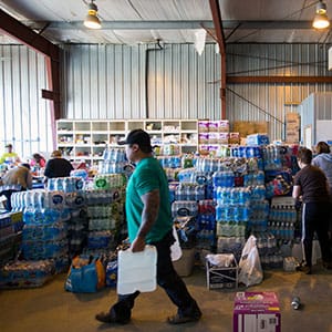 Residents of Fort McMurray, Alberta, sort through donated items brought to a donation centre in Wandering River after evacuating Fort McMurray due to raging wildfires on May 6, 2016. (Topher Seguin/Reuters)