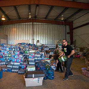 Residents of Fort McMurray, Alberta, sort through donated items brought to a donation centre in Wandering River after evacuating Fort McMurray due to raging wildfires on May 6, 2016. (Topher Seguin/Reuters)