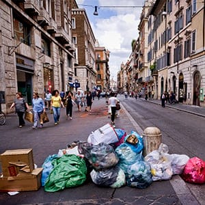 Waste on the Via del Corso in Rome city center during Garbage collectors strike today throughout Italy in support of the dispute for the contract renewal. The workers conducted a protest outside the headquarters of Utilitalia, the association representing the energy and environmental water companies on May 30, 2016 in Rome, Italy. The adherence to the strike was 90% of the 7,800 employees of Ama (Municipal Environment Company Rome) and across Italy where there are about a hundred thousand workers. (Stefano Montesi/Corbis/Getty Images)
