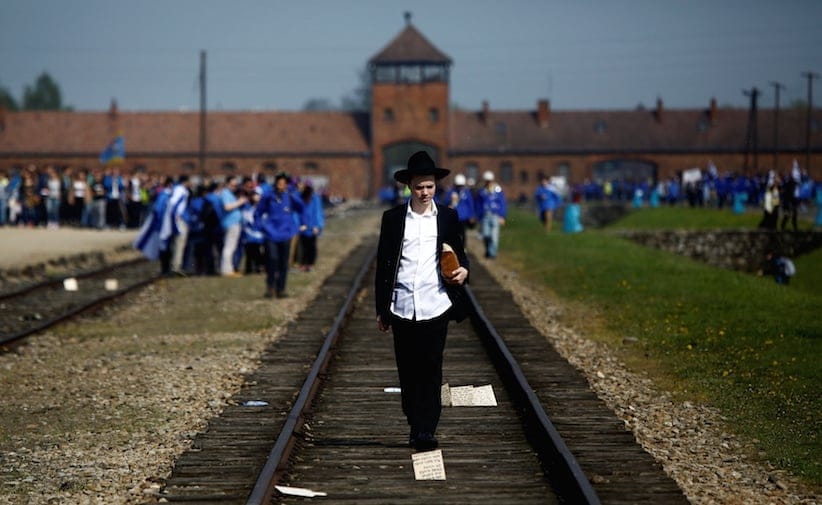 A man walks on the railway tracks in the former Nazi death camp of Auschwitz-Birkenau in May 2016. REUTERS/Kacper Pempel