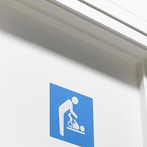 Baby changing sign for a men's washroom. (Peter Dazeley/Getty Images)