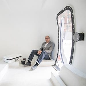 Mitch Kern a photographer and associate professor at ACAD is photographed inside his mobile Camera Obscura in downtown Calgary. Using a 1970 Boler trailer with a light proof door he uses hand-made lenses to project images of the outside on a white wall inside for people to view. But unlike a camera the Trailer Obscura has no recording device. The images one sees inside the chamber upon the walls floor and ceiling are fleeting and ephemeral. (Photograph by Chris Bolin)