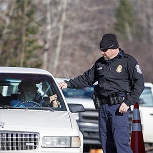 A U.S. Customs and Border Protection agent hands a passport back to a driver entering from Canada at the United States Border Inspection Station in Norton, Vermont, U.S., on Friday, Nov. 18, 2016. (Scott Eisen/Bloomberg via Getty Images)