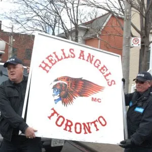 April 4, 2017 photo shows drug busts all over the GTA after police shot here outside the hells angels h.q. on eastern ave after a bust where they broke through the concrete wall and created a huge hole to gain access. hots of them outside and showing the hole in the building shots of the cops taking down hells angel signs and figureheads and erecting their own banner (Colin McConnell/Toronto Star/Getty Images)