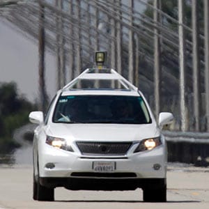 In this Sept. 3, 2013 photo, a Google self-driving car is displayed during a news conference at the Virginia Tech Transportation Institute's Smart Road in Blacksburg, Va. The car is equipped with laser range finders, radar and cameras to monitor its surroundings and react accordingly. Matt Gentry/The Roanoke Times/AP