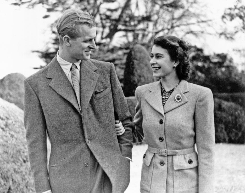 24th November 1947: Princess Elizabeth and The Prince Philip, Duke of Edinburgh enjoying a walk during their honeymoon at Broadlands, Romsey, Hampshire. (Topical Press Agency/Getty Images)