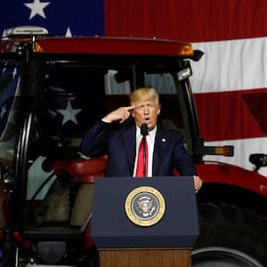 U.S. President Donald Trump (L) takes the stage with U.S. Ambassador to China Terry Branstad (R) before delivering remarks on agriculture at Kirkwood Community College in Cedar Rapids, Iowa, U.S. June 21, 2017. REUTERS/Jonathan Ernst - RTS184DZ