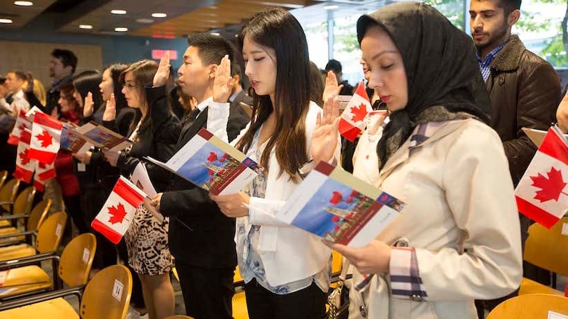 Oct 6 2015--Vancouver BC--Citizenship ceremony: New Canadians take the citizenship oath during a ceremony in Vancouver. (Photographs by Brian Howell)