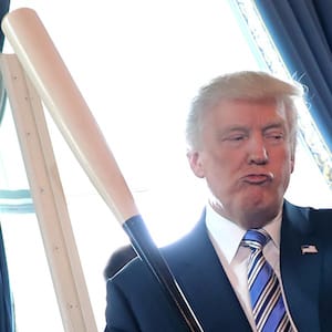 Vice President Mike Pence laughs as U.S. President Donald Trump holds a baseball bat as they attend a Made in America product showcase event at the White House in Washington, U.S., July 17, 2017. REUTERS/Carlos Barria - RTX3BU9K