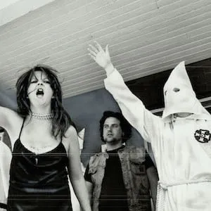 CANADA - JUNE 01: Noisy defiance: Members of the Ku Klux Klan; on the verandah of a Dundas St. E. house in May; raise arms in Nazi-style salute and shout at marchers from Riverdale Action Committee Against Racism who were protesting the Klan's activities. The committee had been infiltrated by the chief of the klan's intelligence agency (KIA). Insight (Photo by David Cooper/Toronto Star via Getty Images)