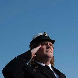 Leading Seaman Danielle Dewitt poses near HMCS Toronto on a jetty in the Canadian Forces naval dockyard in Halifax. (Photograph by Darren Calabrese)