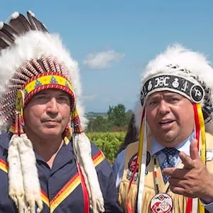 Perry Bellegarde, left, national chief of the Assembly of First Nations, chats with Morley Googoo, regional chief for Nova Scotia and Newfoundland, at a meeting of Atlantic MPs and First Nations chiefs in Wolfville, N.S. on Thursday, Aug. 10, 2017. THE CANADIAN PRESS/Andrew Vaughan