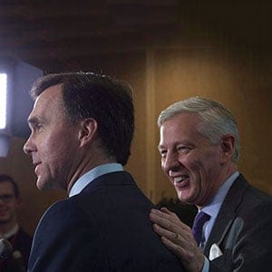 Chairman of the Advisory Council Dominic Barton pats Minister of Finance Bill Morneau on the shoulder as he makes a joke during a news conference in Ottawa, Thursday, October 20, 2016. (Adrian Wyld/CP)