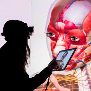 The University of Calgary Campus photos for Macleans Magazine - Nicole Ewart a student and Professor Christian Jacob use VR glasses and iPad in the The Visualization Studio is a state-of-the-art digital facility created to support faculty and graduate researchers. Its primary feature is a high-resolution display wall with surround sound. The studio is designed to provide researchers with significant visual real estate for working with digital information. The display's 34.5 million pixels allow for insight and overview that is impossible to achieve with a desktop monitor or standard projector. (Photograph by Chris Bolin)