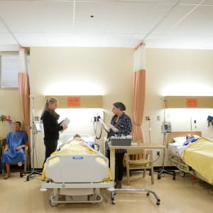 Nursing students learn how to put in IV's in the Faculty of Nursing clinical learning and simulation lab on campus at the University of Manitoba. (Photograph by Marianne Helm)