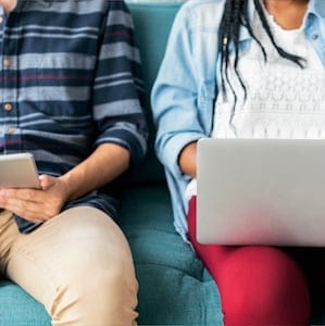 Cropped man and woman using electronic device free image